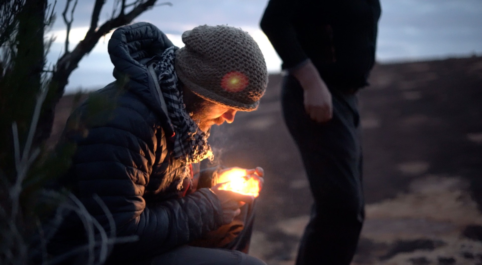 Edge of Wild — lighting the fire at dusk